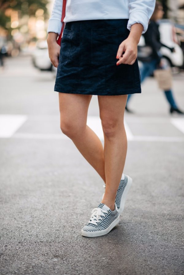 Bows & Sequins wearing an Old Navy blue suede skirt and Claudie Pierlot gingham sneakers.
