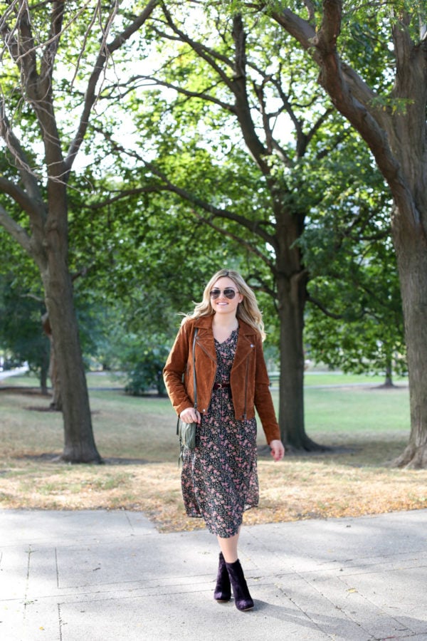 Chicago style blogger Bows & Sequins wearing a cognac suede jacket, an Old Navy floral dress, and purple velvet Marc Fisher booties.