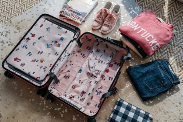 Bows & Sequins sharing packing tips for a carry on suitcase.