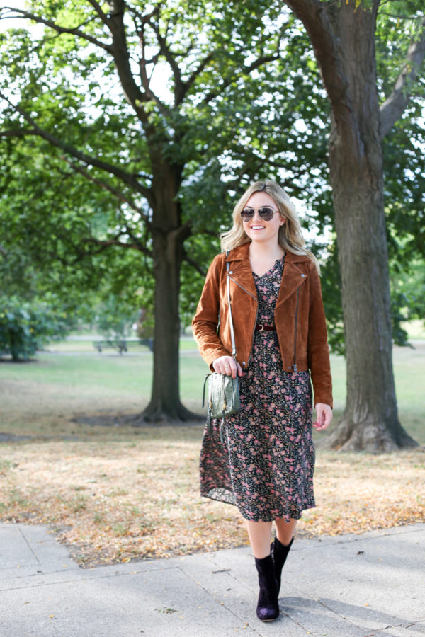 Bows & Sequins wearing Gucci aviators, a Blank NYC cognac suede jacket, a floral midi Old Navy dress, and purple velvet booties.