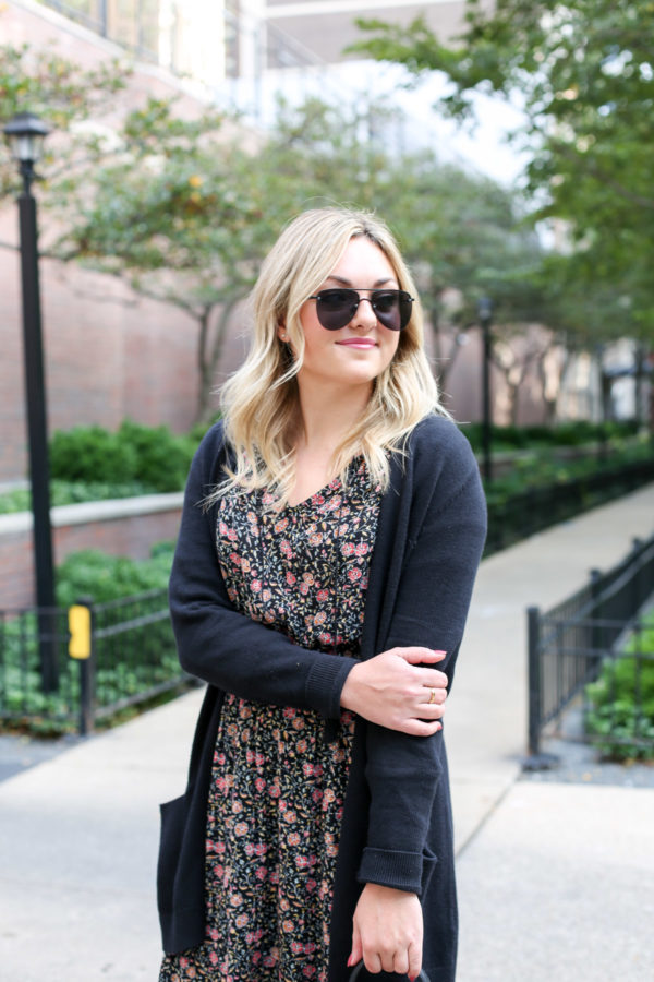 Bows & Sequins wearing matte aviators, a black cardigan, and an Old Navy floral midi dress.