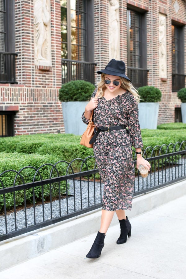 Bows & Sequins wearing an Old Navy hat, a floral print dress, Kate Spade watch, Madewell leather belt, and ankle booties.