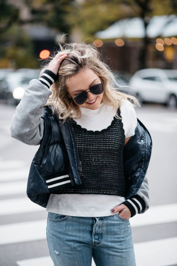 Chicago lifestyle blogger Jessica Rose Sturdy wearing Le Specs matte black aviators, a Veronica Beard puffer bomber jacket, and an Endless Rose layered tee and crochet tank.