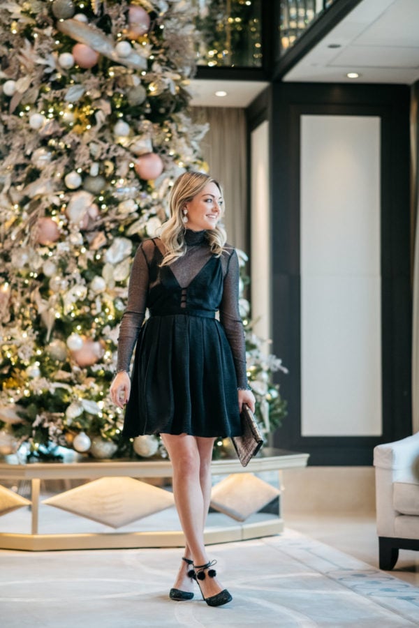 Jessica Sturdy wearing a Free People dress with a sparkle bodysuit, Kate Spade glitter pom pom heels, and a Milly metallic clutch at the Langham in Chicago.