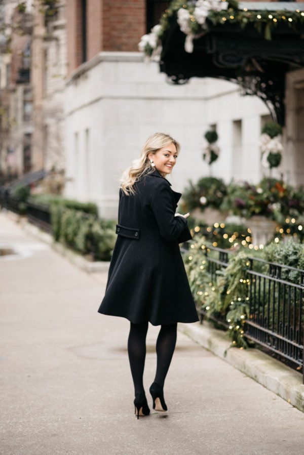 Lifestyle and fashion blogger Jessica Sturdy wearing Loren Hope earrings, a Ralph Lauren black wool coat, J.Crew tights, and Kate Spade black pumps.