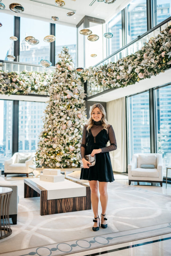 Jessica Sturdy wearing a Free People dress with a sparkle bodysuit, Kate Spade glitter pom pom heels, and a Milly metallic clutch at the Langham in Chicago.