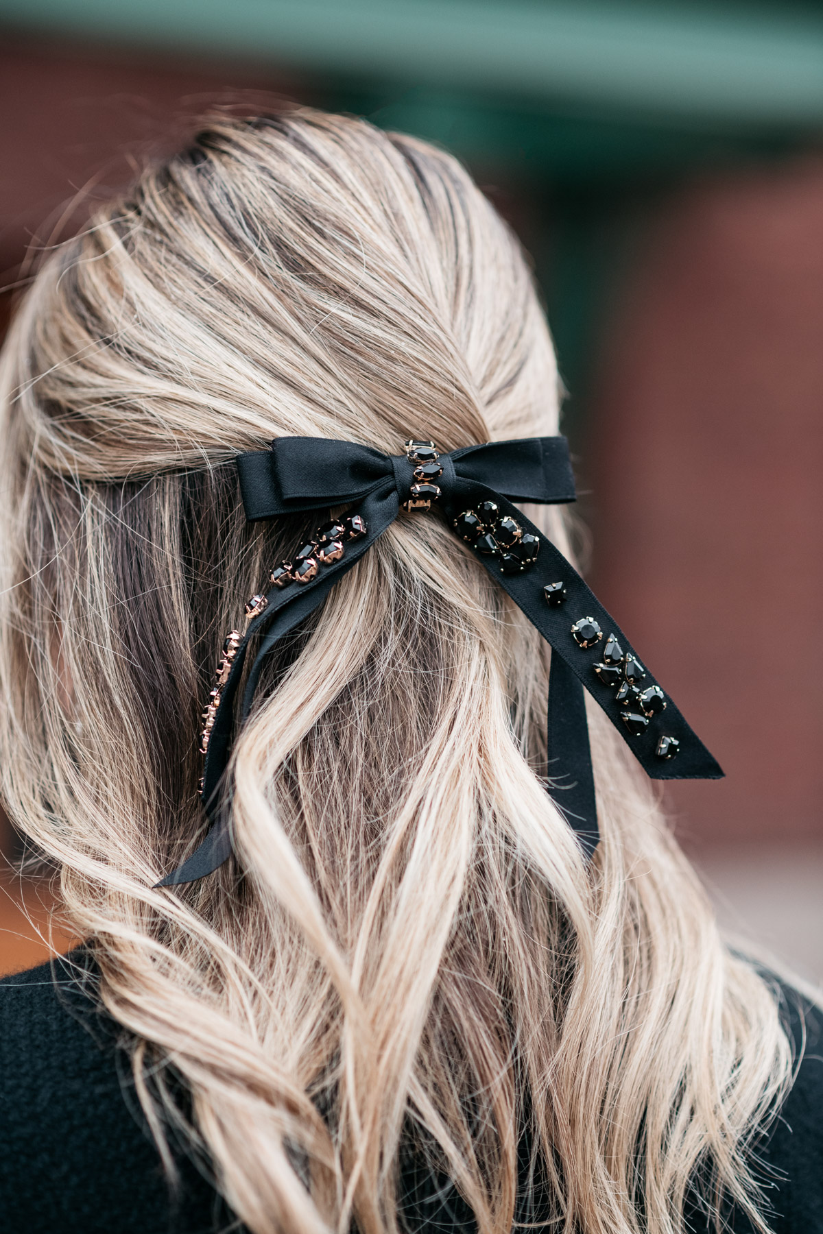 Jessica Sturdy wearing a black jeweled hair bow from J.Crew.