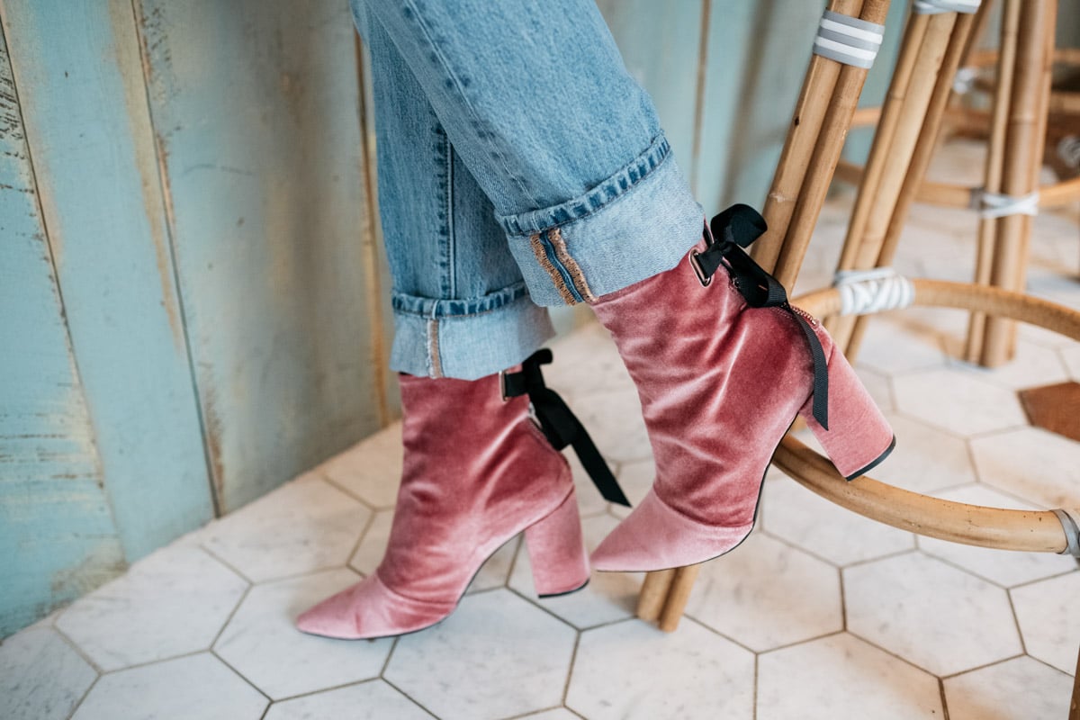 Fashion blogger Jessica Sturdy wearing pink velvet booties and cuffed Levi's 501.