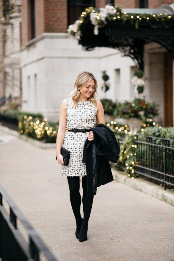 Jessica Rose Sturdy wearing a Sail to Sable bow dress, Loren Hope earrings, J.Crew tights, and Kate Spade pumps with a Ralph Lauren wool coat and an envelope clutch.