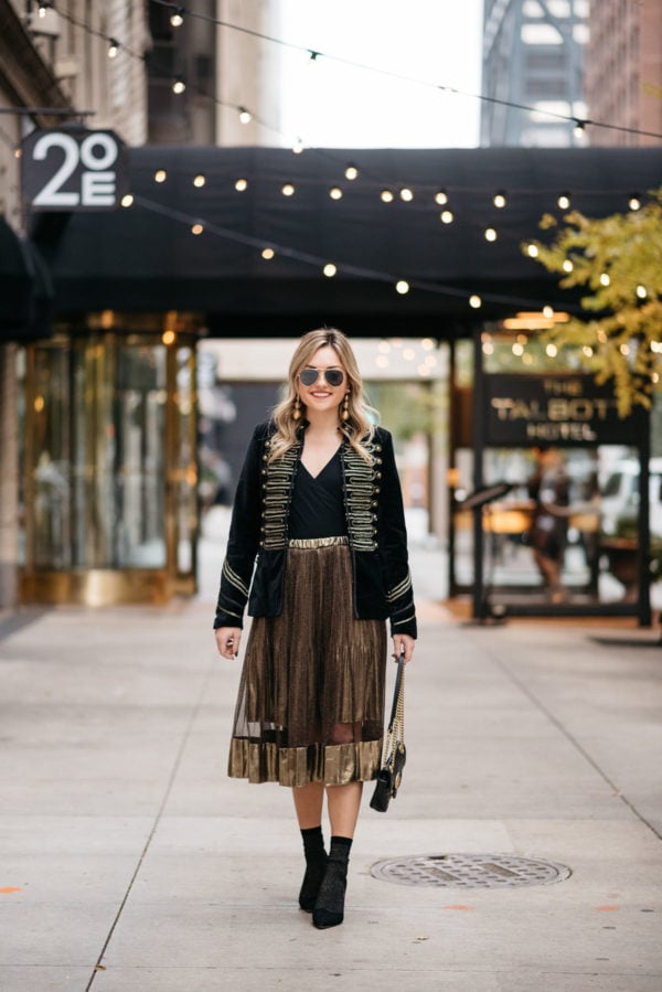 Chicago fashion and lifestyle blogger Jessica Rose Sturdy wearing Ray-Ban aviators, Blank NYC black velvet and gold embroidered band jacket, J.Crew bodysuit, gold midi skirt, black & gold shimmer socks, and Kate Spade black suede pumps with Kenneth Jay Lane gold earrings and a Gucci Marmont black leather bag.