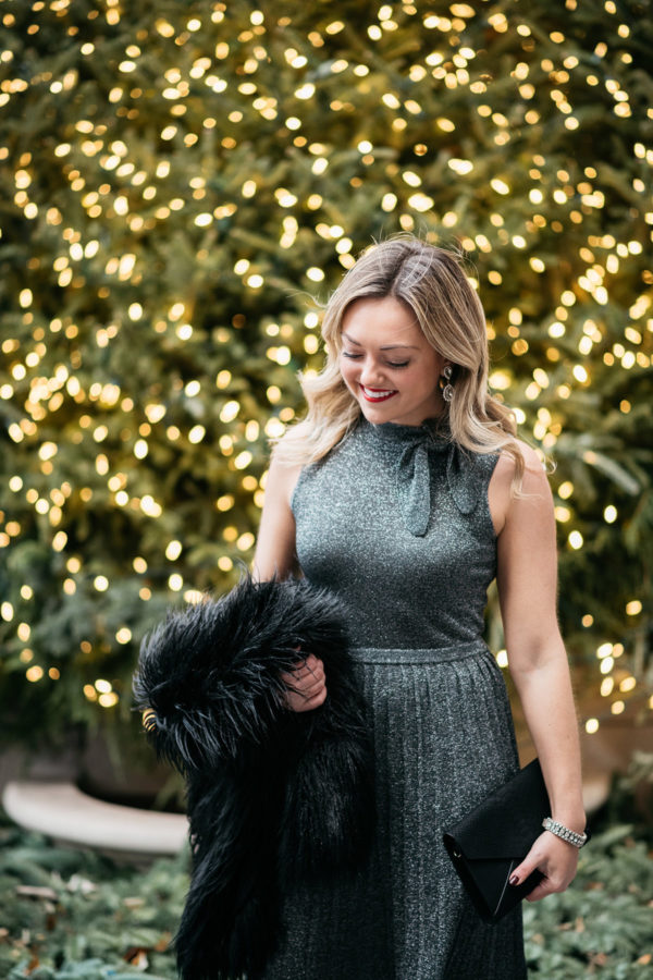 Jessica Sturdy wearing a silver Kate Spade sweater dress.