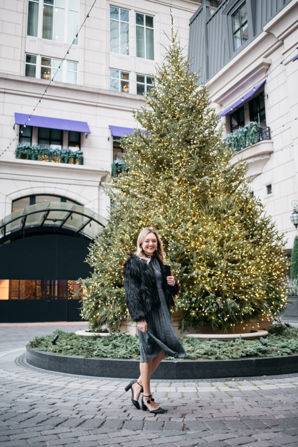 Jessica Sturdy wearing a silver dress and black faux fur coat.