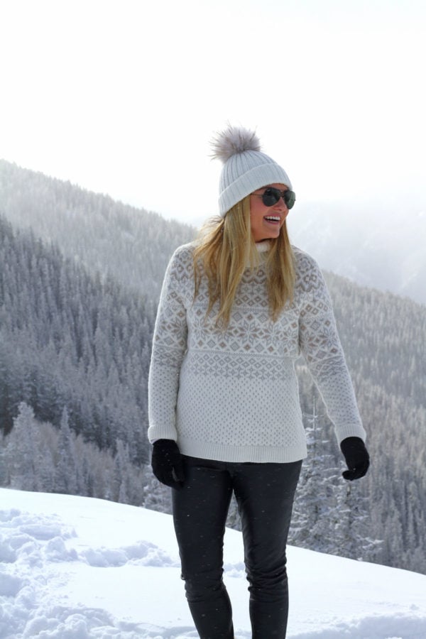 Jessica Sturdy on Apsen Mountain in a fairisle sweater and fur pom pom beanie.