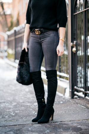 Chicago lifestyle blogger Jessica Rose Sturdy wearing black suede over the knee boots, Rag & Bone skinny jeans, and a gold Gucci GG logo belt with a J.Crew shearling bag.
