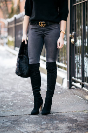 Chicago lifestyle blogger Jessica Rose Sturdy wearing black suede over the knee boots, Rag & Bone skinny jeans, and a gold Gucci GG logo belt with a J.Crew shearling bag.