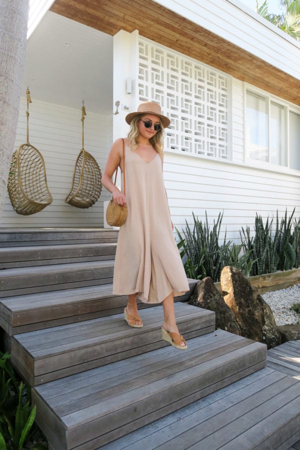 Jessica Sturdy wearing a long jumpsuit and espadrille wedges at Bask & Stow in Byron Bay Australia