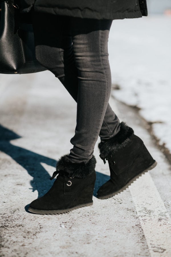 Jessica Sturdy wearing fur-trimmed booties with black denim for winter in Chicago.