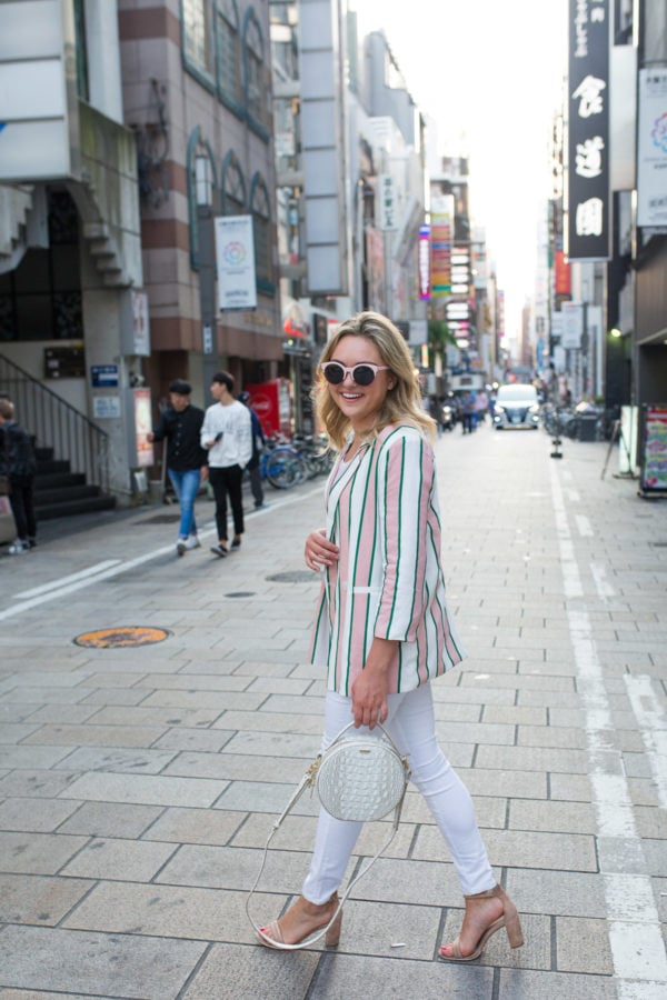 Travel blogger Jessica Sturdy wearing an all white outfit in Japan.