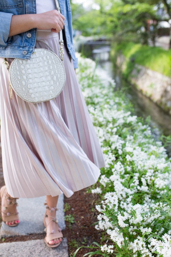 Jessica Sturdy styling a Rachel Roy pleated lavender midi skirt along the Philosopher's Path in Kyoto, Japan.