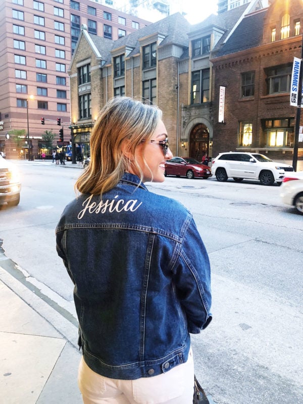 Jessica Sturdy wearing a custom denim jacket from Everlane with white jeans.