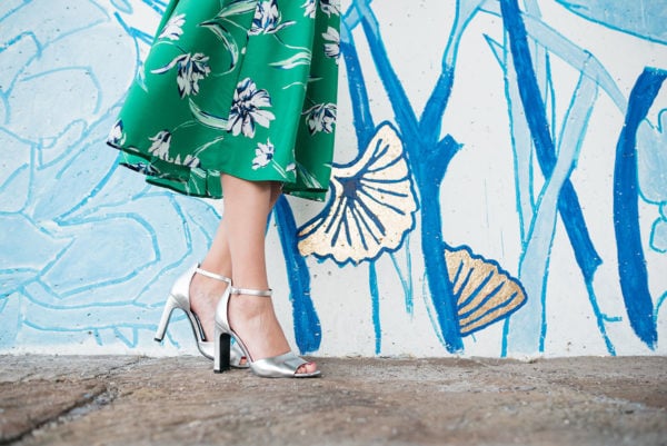 Bows & Sequins wearing a pair of Marc Fisher silver ankle-strap heels.