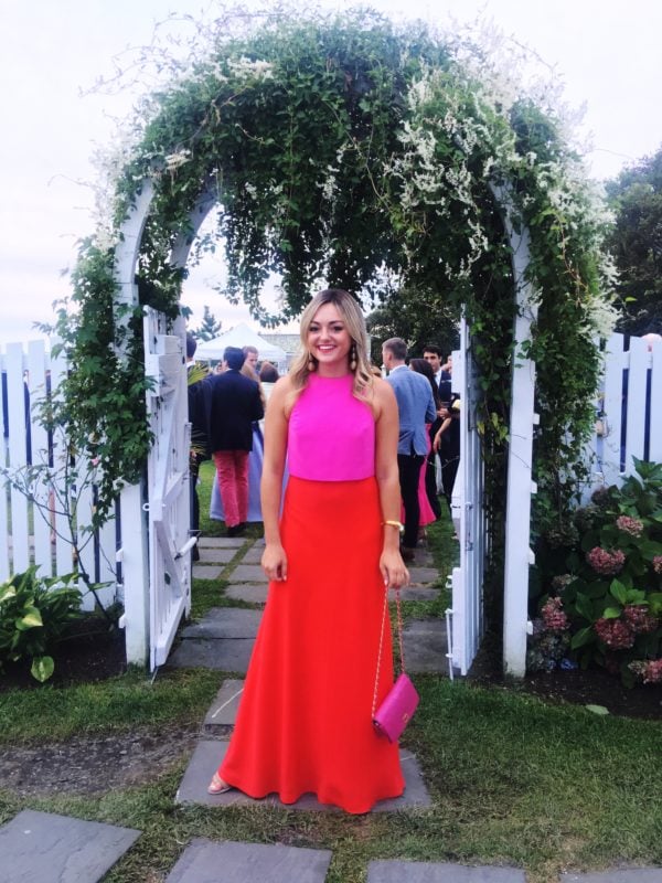 Jessica Sturdy wearing a red and pink colorblocked dress in Nantucket at Summer House at Mackenzie Horan's wedding.