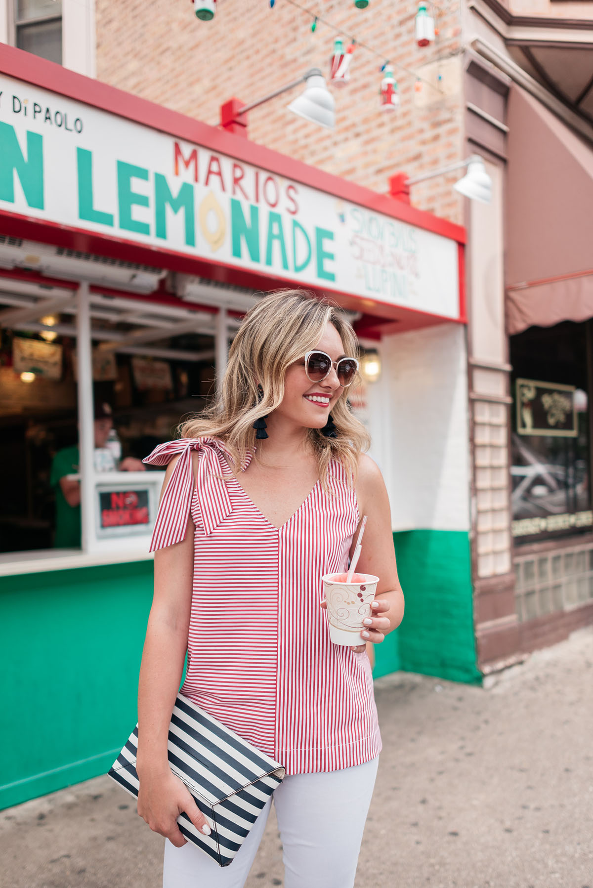 Chicago fashion blogger Jessica Sturdy wearing a red and white striped top from Vineyard Vines with a bow shoulder.
