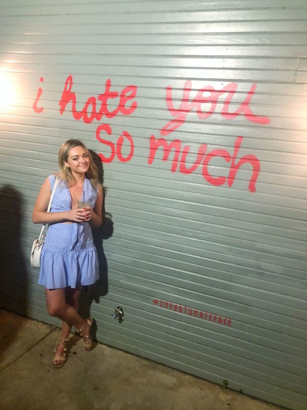 Travel blogger at bar on Rainey Street in Austin Texas