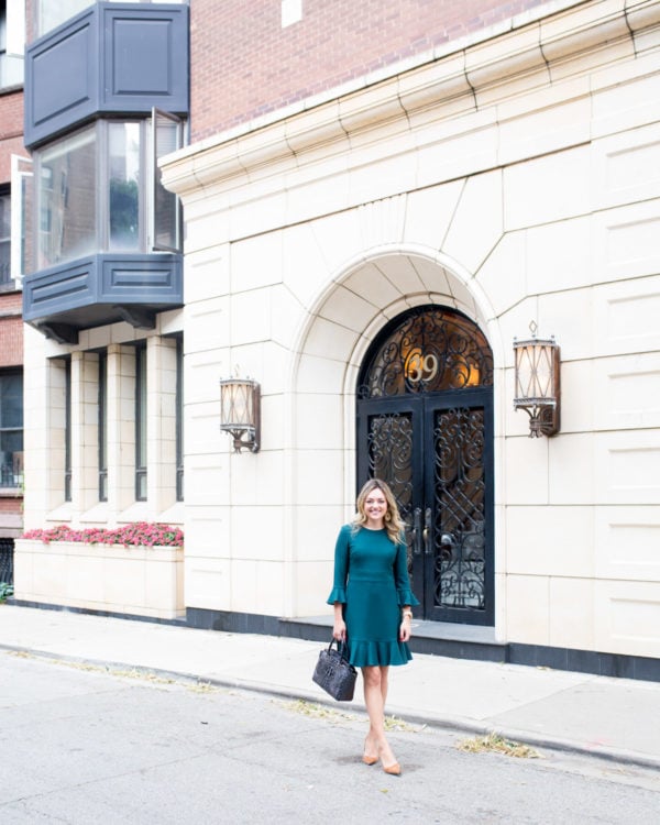 Chicago fashion blogger Jessica Sturdy wearing a ruffled hem long sleeve dress by Eliza J.