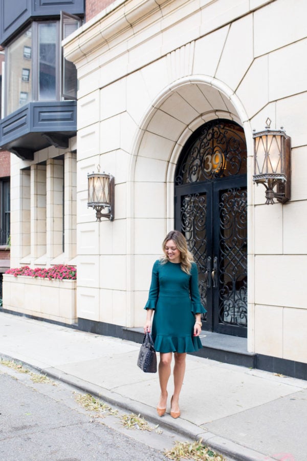 Chicago fashion blogger Bows & Sequins wearing an Eliza J dress with pumps and a cute work bag.