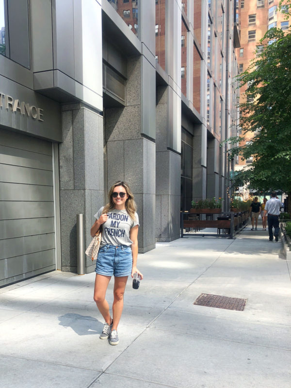 Chicago street style blogger wearing a Pardon My French Tee, high-waisted shorts, and gingham sneakers.