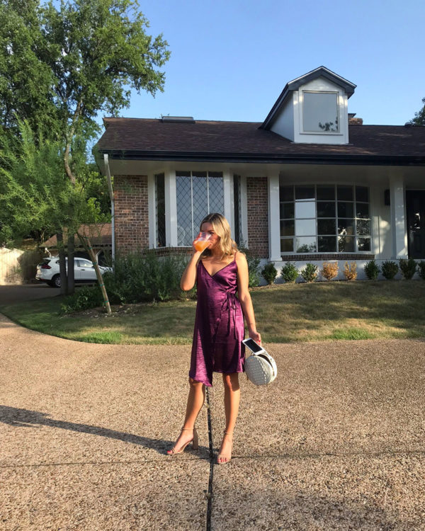 Silk purple wrap dress with white circle bag