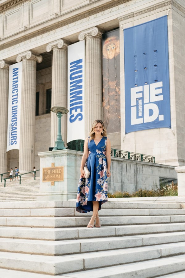 Jessica Sturdy wearing a formal floral Eliza J dress in front of the Field Museum in Chicago.