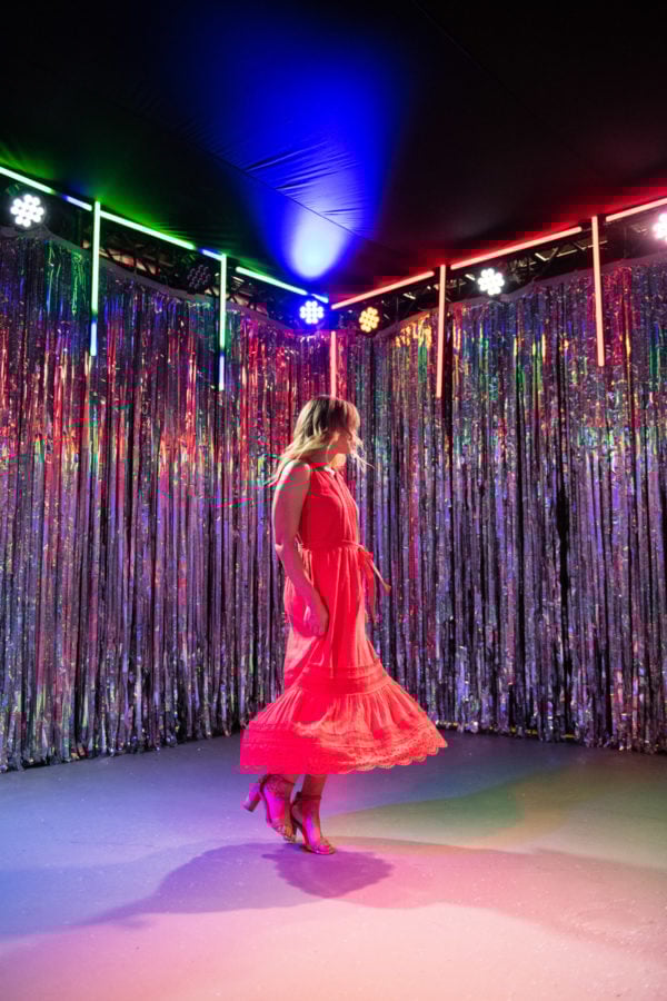 Chicago fashion blogger Jessica Sturdy wearing a red maxi dress in a disco room at Happy Place