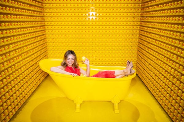 Jessica Sturdy, Chicago-based fashion and travel blogger, at Happy Place in the yellow bathtub.
