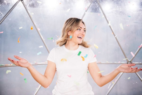 Chicago blogger Jessica Sturdy throwing confetti at Happy Place.