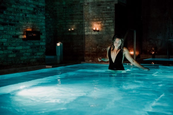 Bows & Sequins at AIRE Ancient Baths in the Caldarium hot bath.