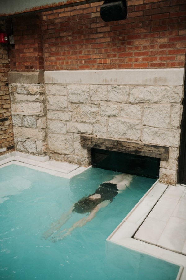 AIRE Ancient Baths Chicago indoor outdoor swim-under pool.