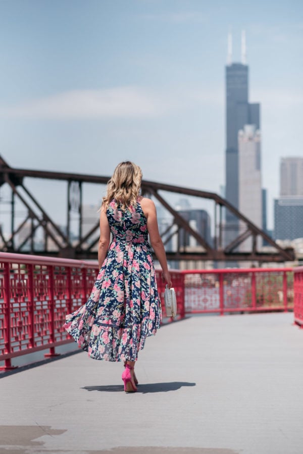 Chicago style blogger wearing a pink and navy floral dress.