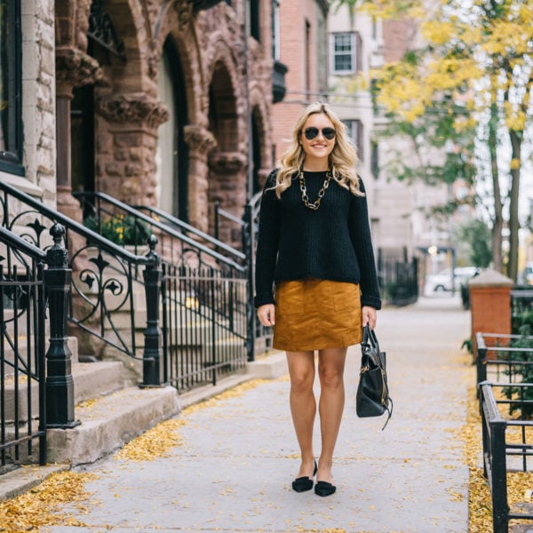 Chicago fashion blog Bows & Sequins wearing a suede skirt and oversized sweater during the fall in Gold Coast.