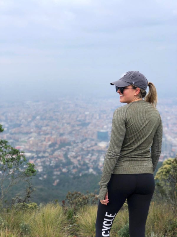 Remote Year blogger Jessica Sturdy in Bogota, Colombia on the top of a mountain overlooking the city after a morning hike.