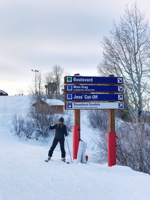 Travel and lifestyle influencer skiing in Steamboat Springs, Colorado.