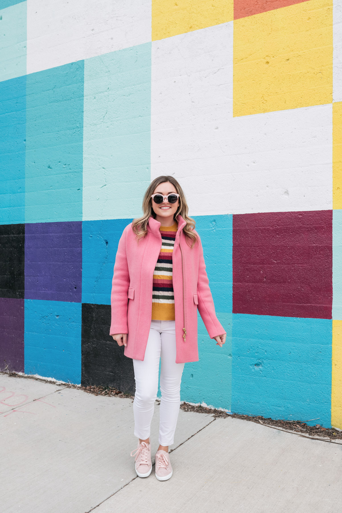 Chicago blogger Jessica Sturdy of Bows & Sequins styles a striped cashmere sweater with white jeans, blush pink suede sneakers, and a J.Crew cocoon coat.
