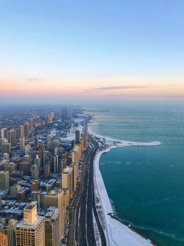 View from the Hancock Building's 360 Observatory on the 94th floor in Chicago. This is looking north at the lake and the Gold Coast, Old Town, and Lincoln Park at sunrise!