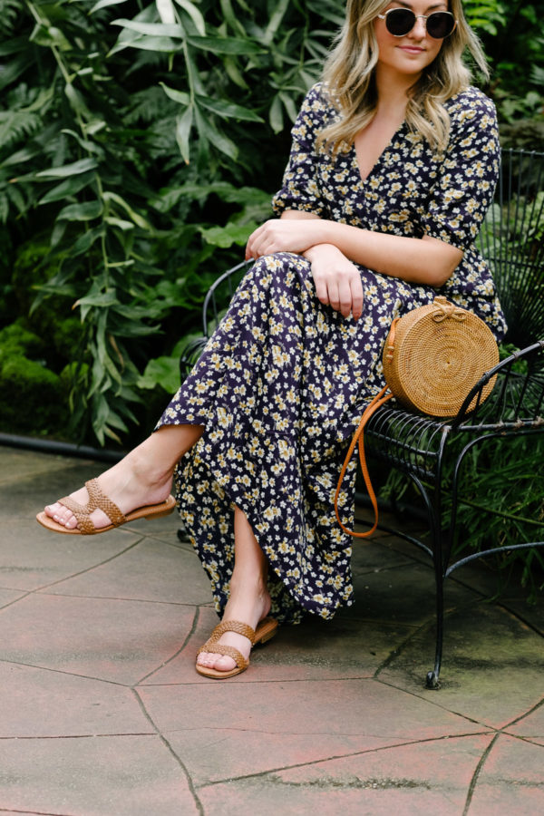 Chicago blogger Bows & Sequins styling Sam Edelman sandals, a floral maxi dress, and a round wicker bag.