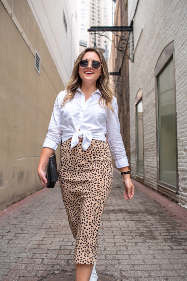 Chicago blogger Jessica Sturdy of Bows & Sequins wearing a white collared shirt with a leopard skirt.