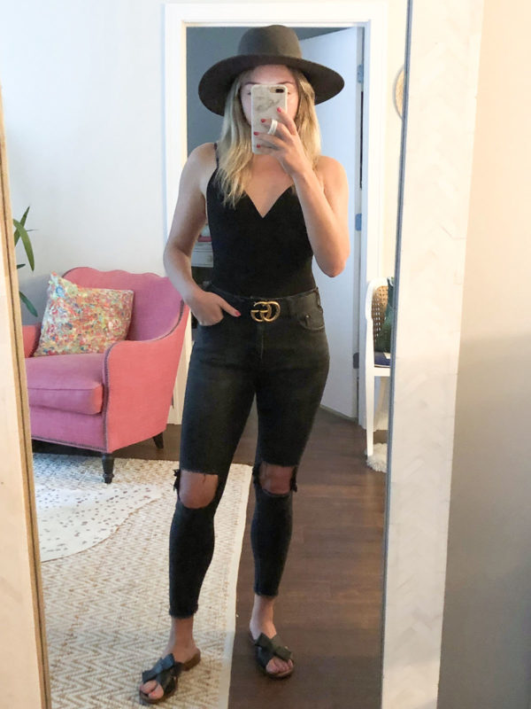 Fashion blogger Bows & Sequins wearing a bodysuit with black One Teaspoon jeans, a Gucci belt, and a black Janessa Leone hat.