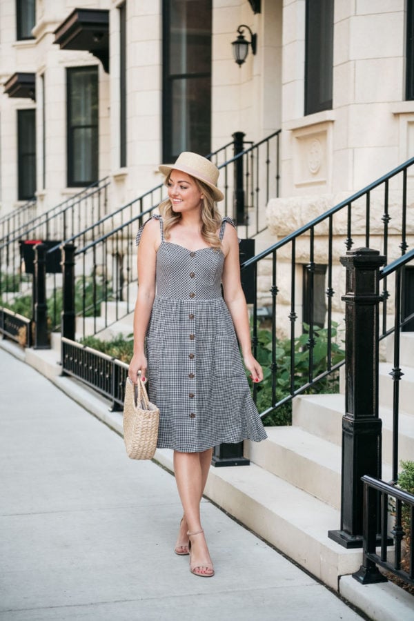 Chicago fashion and lifestyle blogger Bows & Sequins wearing a gingham dress with blush pink heels and a straw hat.
