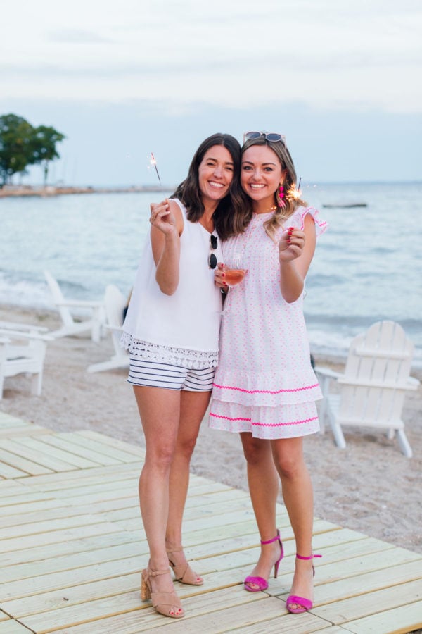 Liz Adams and Jessica Sturdy with sparklers at Sail to Sable's Set Sail Summer Blogger Beach Party.