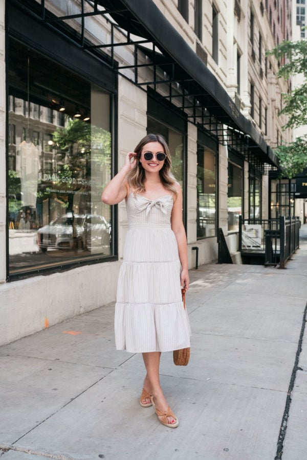 Bows & Sequins styling a striped tiered sundress.